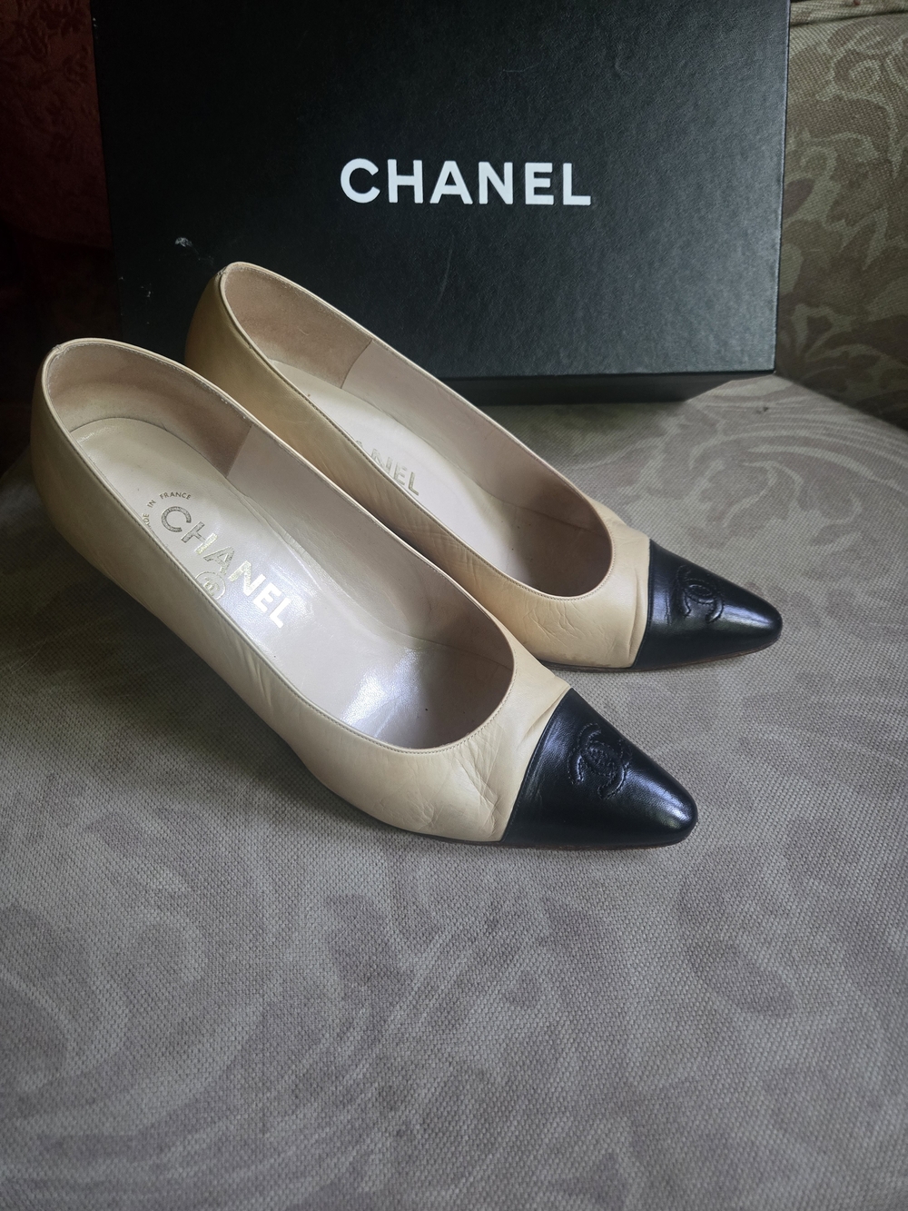 CHANEL Two-Tone Beige and Black Cap-Toe Leather Pumps